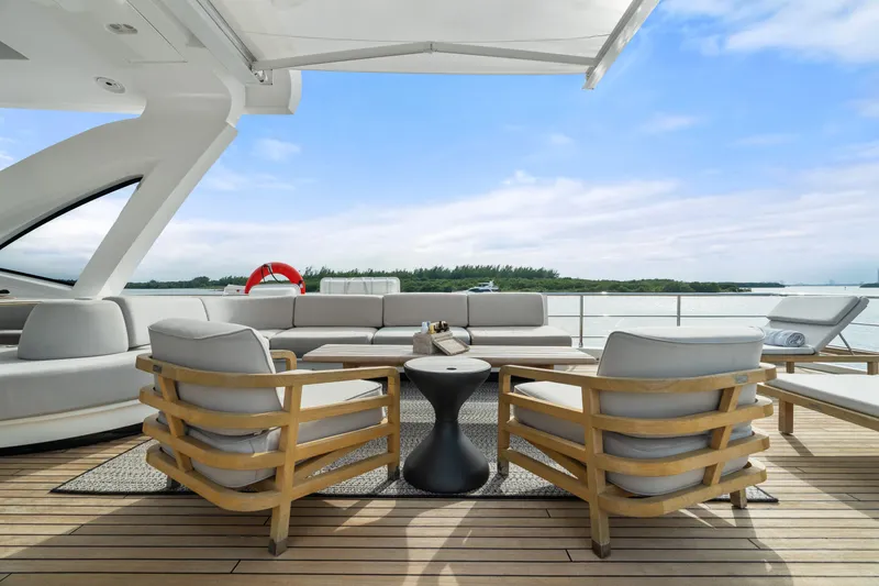 Slide: The Image of Luxurious deck of 2022 Azimut Grande 32 Metri yacht with elegant seating and scenic view. - 25