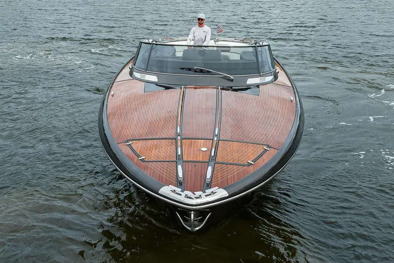 Slide: The Image of 2014 Riva 44' Rivarama luxury yacht cruising on open water. - 12