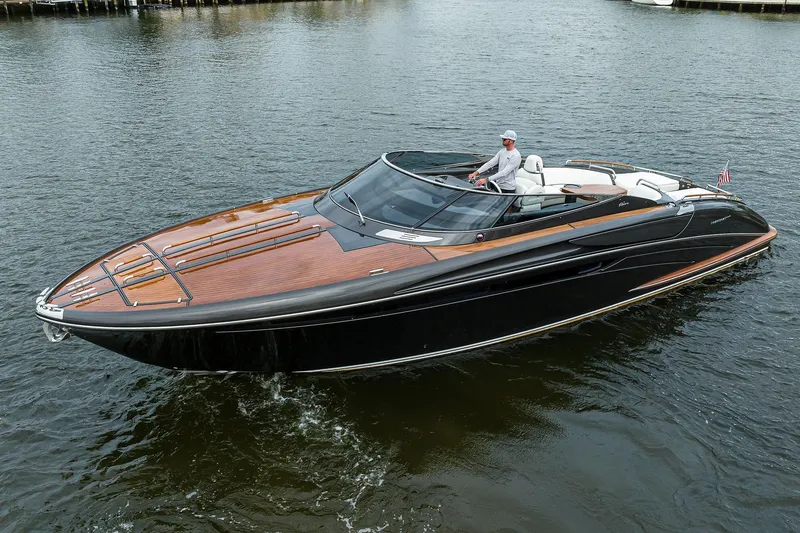 Slide: The Image of 2014 Riva 44' Rivarama luxury yacht cruising on calm waters. - 7
