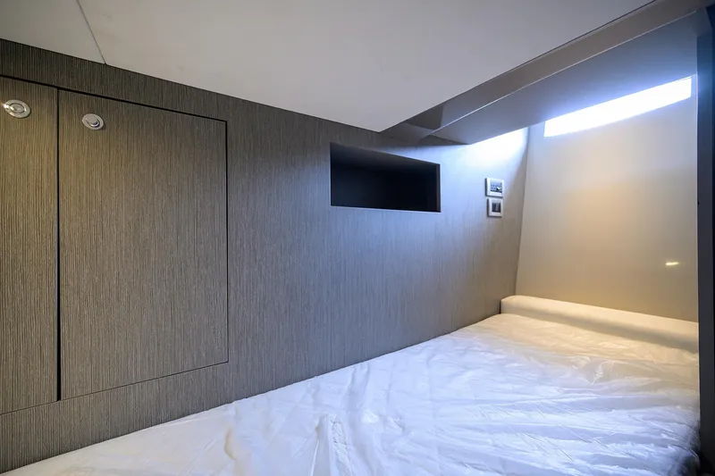 Slide: The Image of Interior cabin of 2014 Riva 44' Rivarama yacht, featuring modern design and cozy bedding. - 42