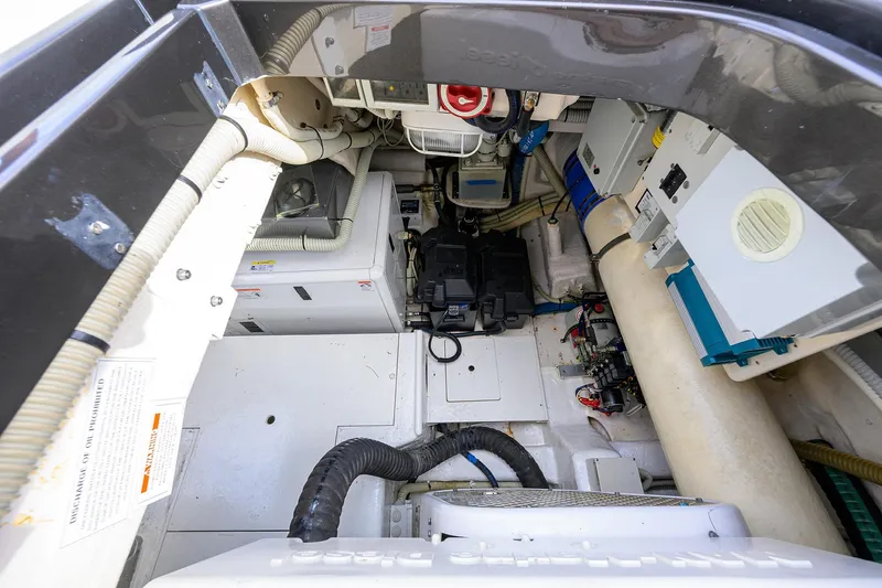 Slide: The Image of Engine room of a 2014 Riva 44' Rivarama yacht, showcasing mechanical components. - 96