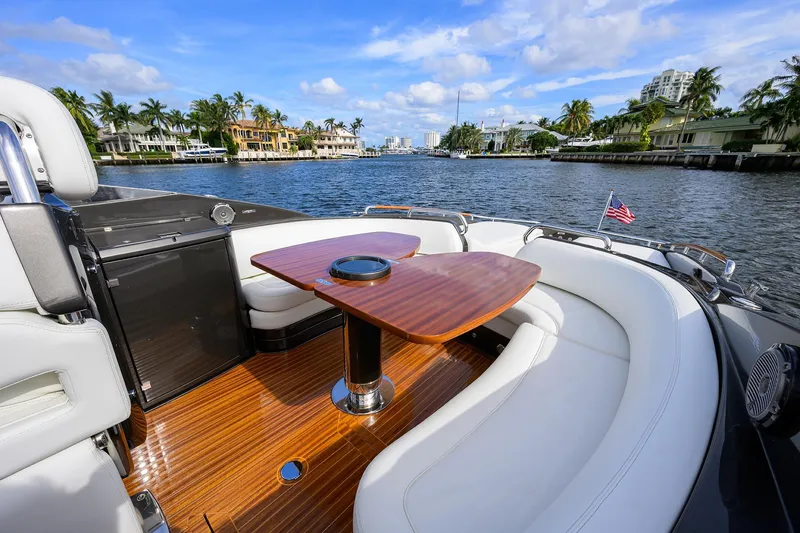 Slide: The Image of Luxurious 2014 Riva 44' Rivarama yacht interior with elegant seating and wooden table. - 51