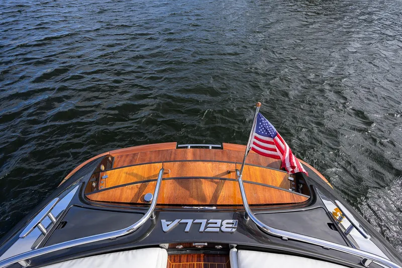 Slide: The Image of 2014 Riva 44' Rivarama yacht with American flag on water. - 18