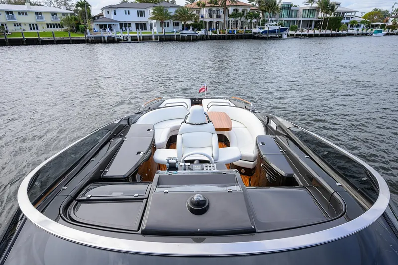 Slide: The Image of Luxurious 2014 Riva 44' Rivarama yacht with elegant seating and waterfront view. - 20