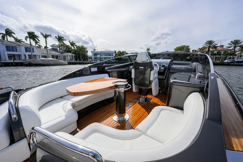Slide: The Image of Luxurious 2014 Riva 44' Rivarama yacht interior with elegant seating and wooden deck. - 60