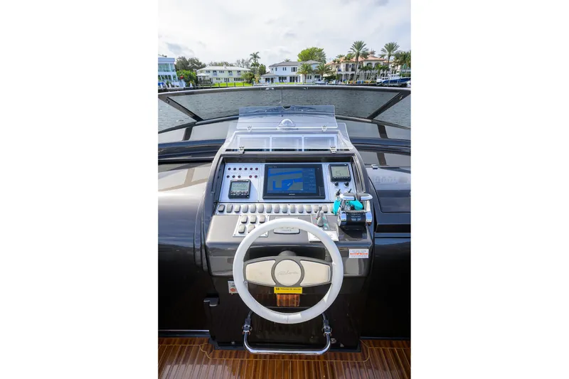 Slide: The Image of Cockpit of 2014 Riva 44' Rivarama yacht with modern navigation controls. - 27