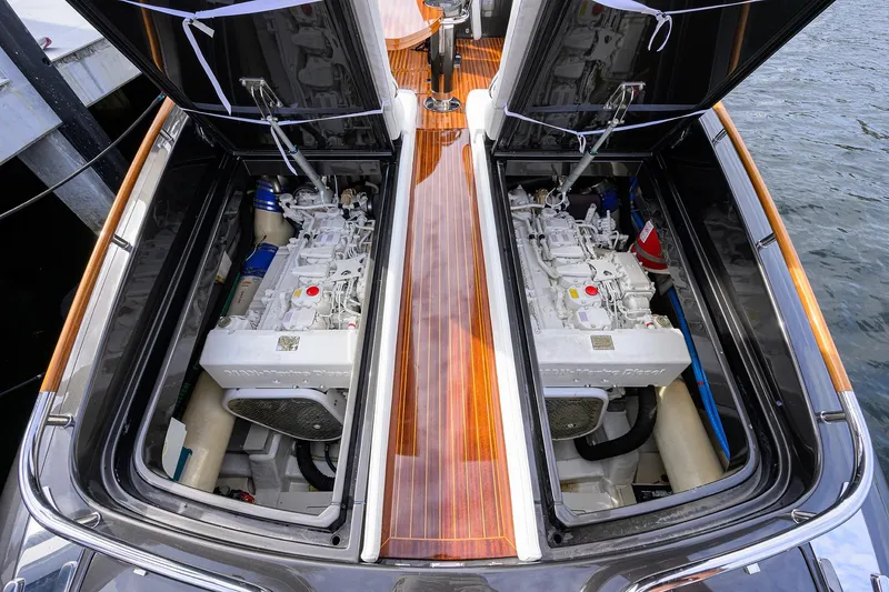 Slide: The Image of Engine compartment of 2014 Riva 44' Rivarama yacht, showcasing twin engines and sleek design. - 81