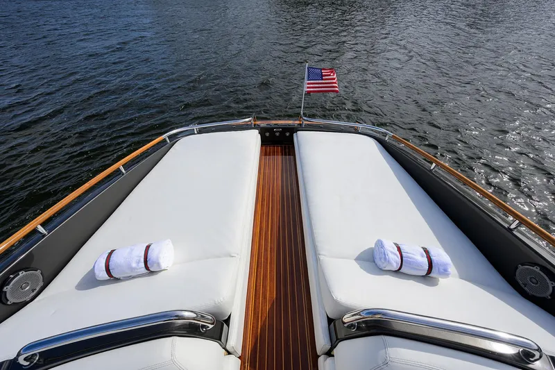 Slide: The Image of Luxurious 2014 Riva 44' Rivarama yacht deck with towels and American flag. - 89