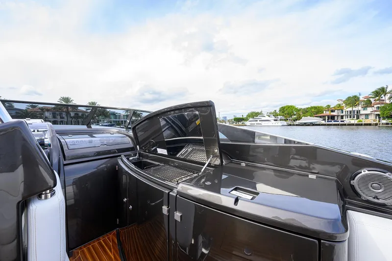 Slide: The Image of 2014 Riva 44' Rivarama yacht with sleek deck design and waterfront view. - 49