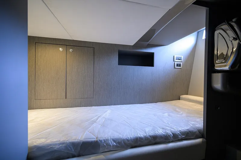 Slide: The Image of Interior cabin of 2014 Riva 44' Rivarama yacht, featuring a sleek, modern bed design. - 43
