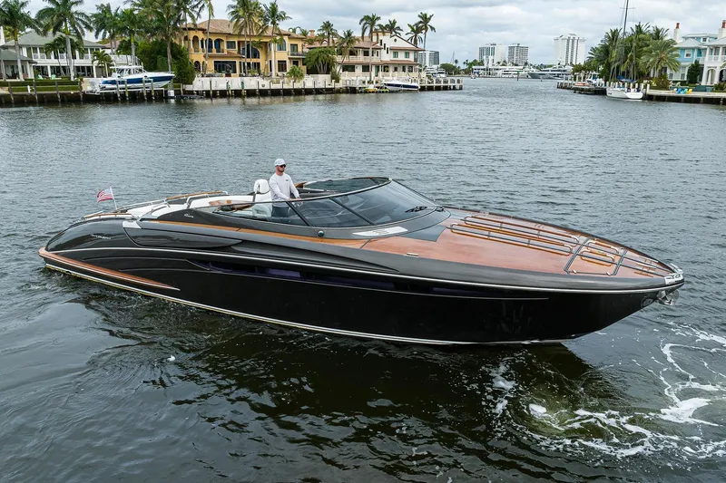 Slide: The Image of Luxurious 2014 Riva 44' Rivarama yacht cruising on a scenic waterway. - 5