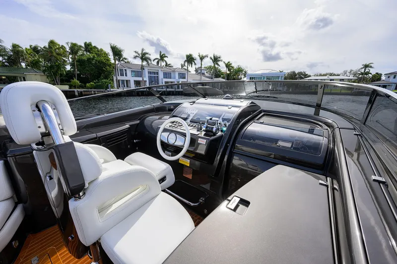 Slide: The Image of Interior view of 2014 Riva 44' Rivarama yacht cockpit with luxurious white seating. - 23
