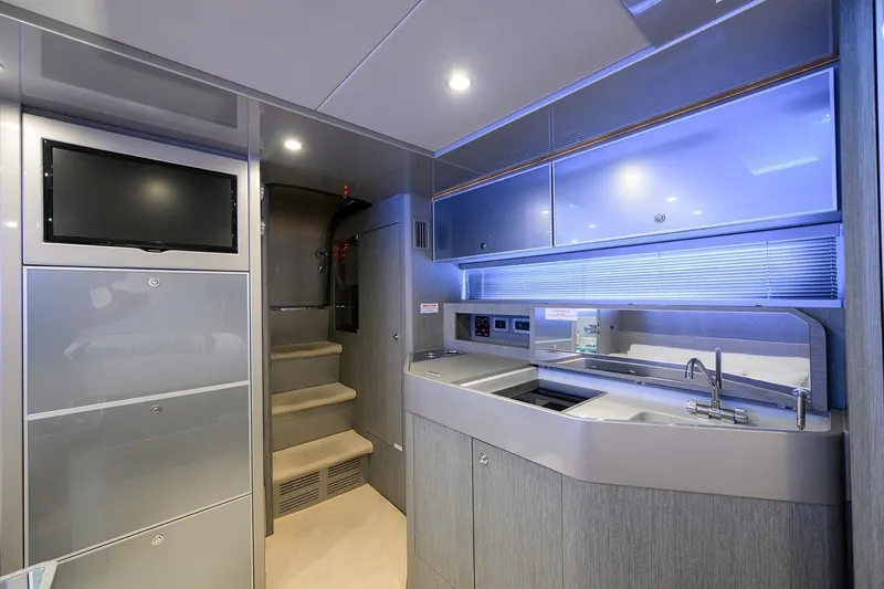 Slide: The Image of Luxurious interior of 2014 Riva 44' Rivarama yacht with modern kitchen and sleek design. - 76