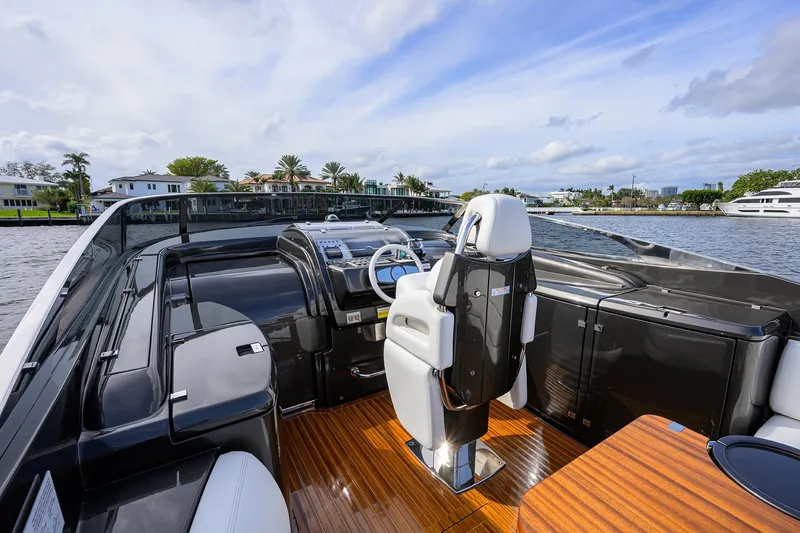 Slide: The Image of Luxurious 2014 Riva 44' Rivarama yacht with sleek design and modern cockpit on the water. - 35