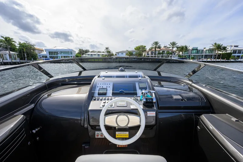 Slide: The Image of Cockpit view of 2014 Riva 44' Rivarama luxury yacht on a scenic waterway. - 30