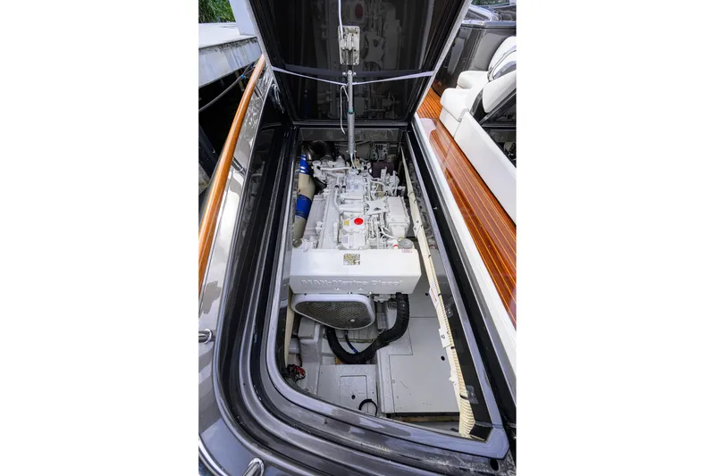 Slide: The Image of Engine compartment of a 2014 Riva 44' Rivarama luxury yacht, showcasing detailed mechanics. - 93
