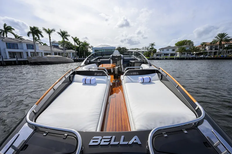 Slide: The Image of Luxurious 2014 Riva 44' Rivarama yacht docked by waterfront homes. - 91