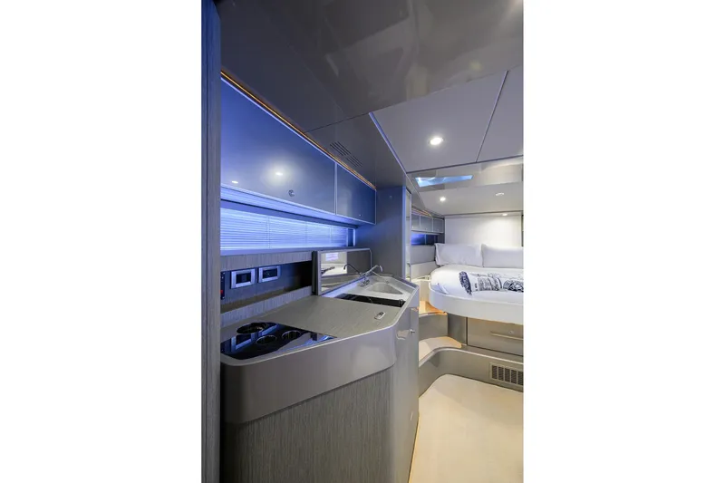Slide: The Image of Luxurious interior of 2014 Riva 44' Rivarama yacht with modern kitchenette and cozy sleeping area. - 75