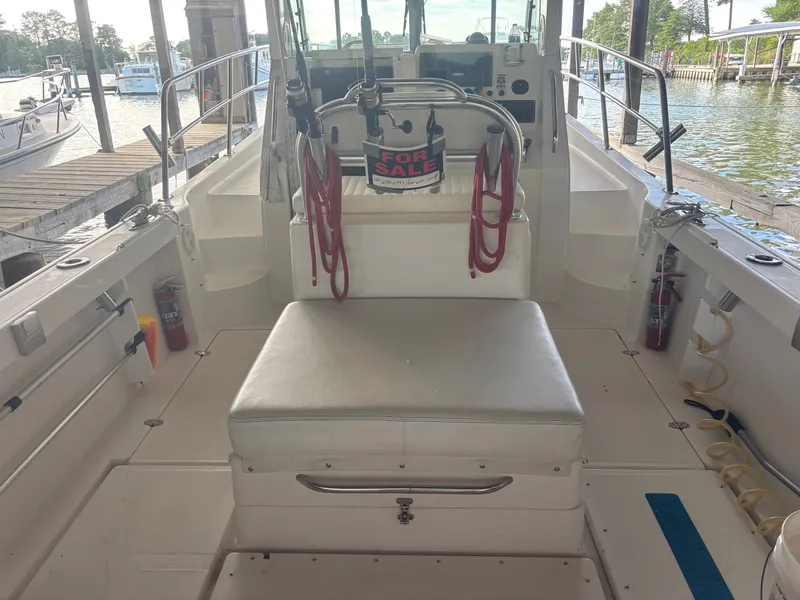 Slide: The Image of The image shows the cockpit of a 2004 True World Marine 286 boat. It is marked for sale. - 3
