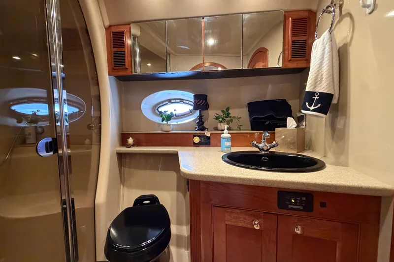 Slide: The Image of Luxurious bathroom interior of 2003 Cruisers Yachts 5470 Express with elegant fixtures and decor. - 33