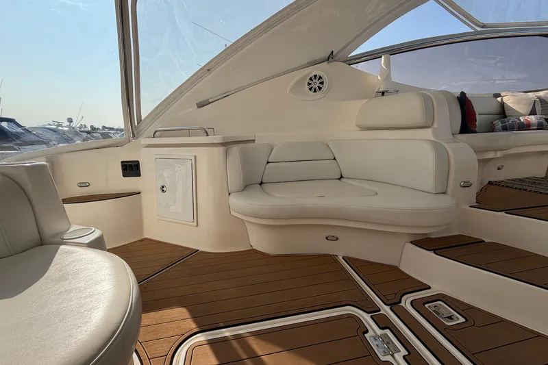 Slide: The Image of Luxurious interior of a 2003 Cruisers Yachts 5470 Express with elegant seating and wood flooring. - 11