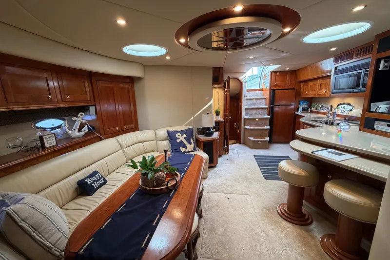 Slide: The Image of Luxurious interior of 2003 Cruisers Yachts 5470 Express with elegant seating and modern amenities. - 28