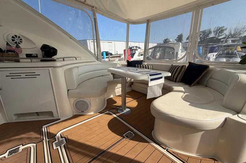 Slide: The Image of Luxurious interior of 2003 Cruisers Yachts 5470 Express with elegant seating and table. - 7