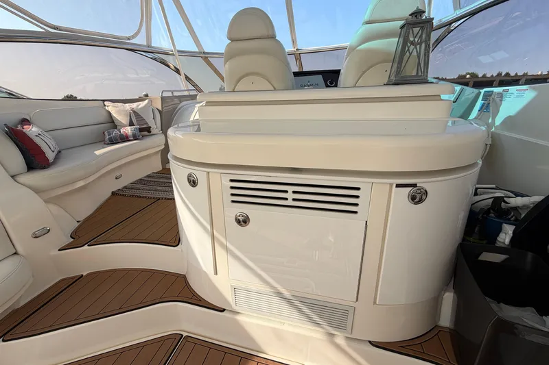 Slide: The Image of Luxurious interior of 2003 Cruisers Yachts 5470 Express with elegant seating and helm. - 12