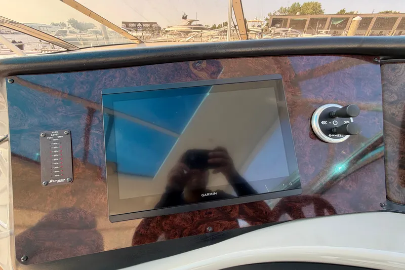 Slide: The Image of Dashboard of 2003 Cruisers Yachts 5470 Express with Garmin display and controls. - 20