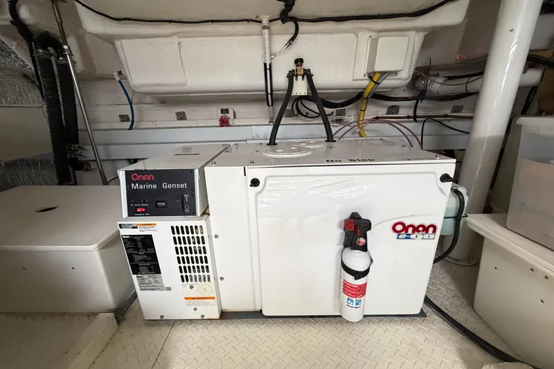 Slide: The Image of Engine room of 2003 Cruisers Yachts 5470 Express with Onan Marine Genset. - 40