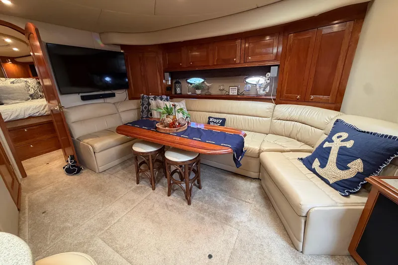 Slide: The Image of Luxurious interior of 2003 Cruisers Yachts 5470 Express with elegant seating and decor. - 26