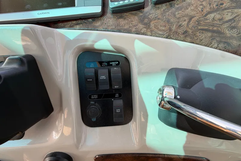 Slide: The Image of Control panel of a 2003 Cruisers Yachts 5470 Express with Garmin navigation system. - 19