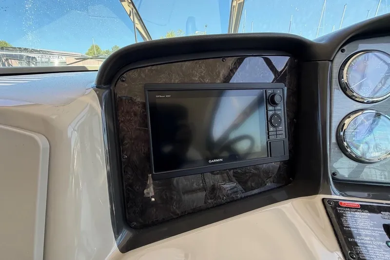 Slide: The Image of Dashboard of 2007 Sea Ray 380 Sundancer with Garmin GPS display and gauges. - 16