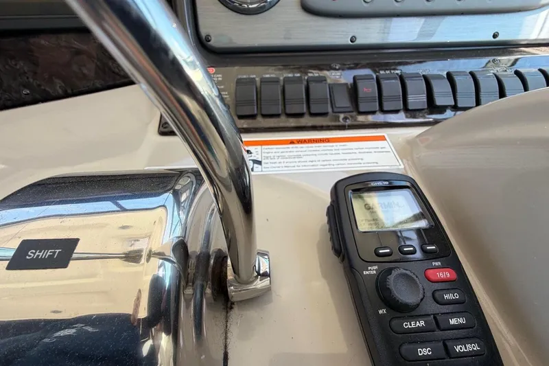 Slide: The Image of Control panel of a 2007 Sea Ray 380 Sundancer with radio and shift lever. - 20