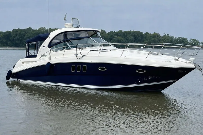 The Image of 2007 Sea Ray 380 Sundancer yacht on calm water, featuring sleek design and luxurious amenities. - 0