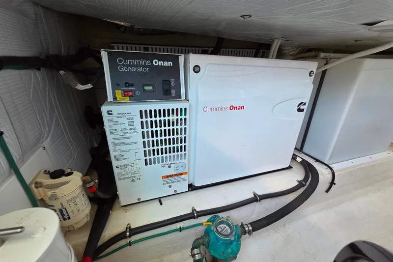 Slide: The Image of Cummins Onan generator in 2018 Back Cove 37 boat engine room. - 93