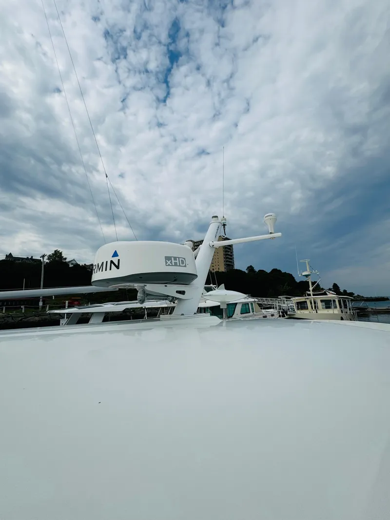 Slide: The Image of The image shows the roof of a Back Cove 37 boat with radar equipment. - 20