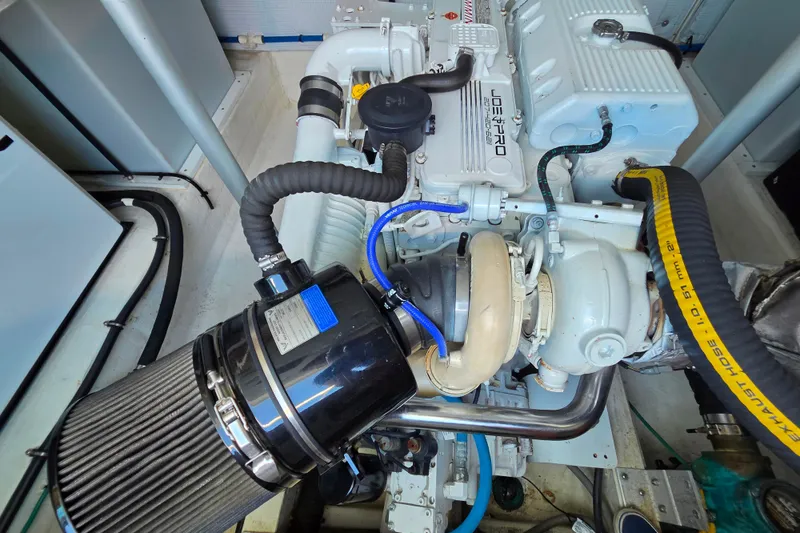 Slide: The Image of Engine compartment of a 2018 Back Cove 37 boat, featuring a modern marine engine. - 91