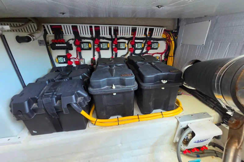 Slide: The Image of Electrical system of a 2018 Back Cove 37 boat, featuring battery boxes and wiring. - 85