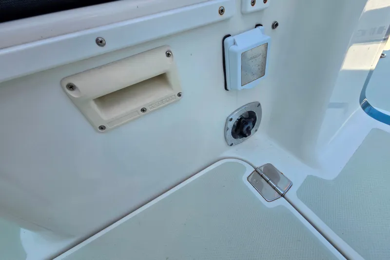 Slide: The Image of 2018 Back Cove 37 boat deck detail with utility access panel and fittings. - 99