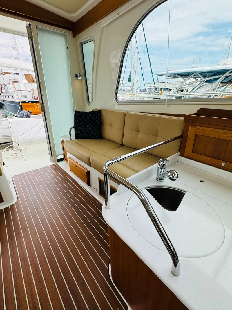 Slide: The Image of Interior of a 2018 Back Cove 37 with a sofa and sink. - 31