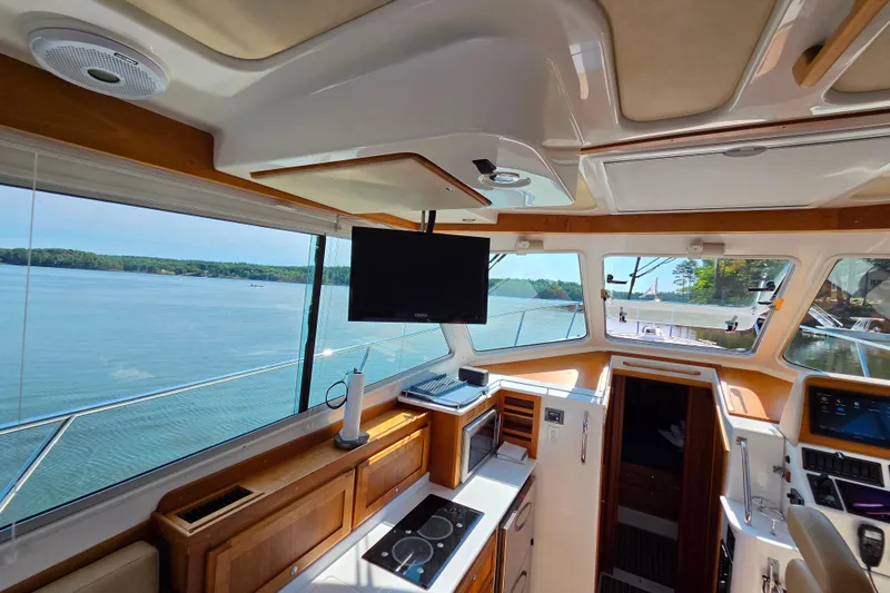 Slide: The Image of Interior view of 2018 Back Cove 37 yacht with modern amenities and scenic water view. - 78