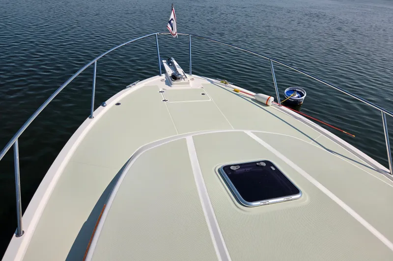 Slide: The Image of Bow view of 2018 Back Cove 37 boat on calm water. - 21