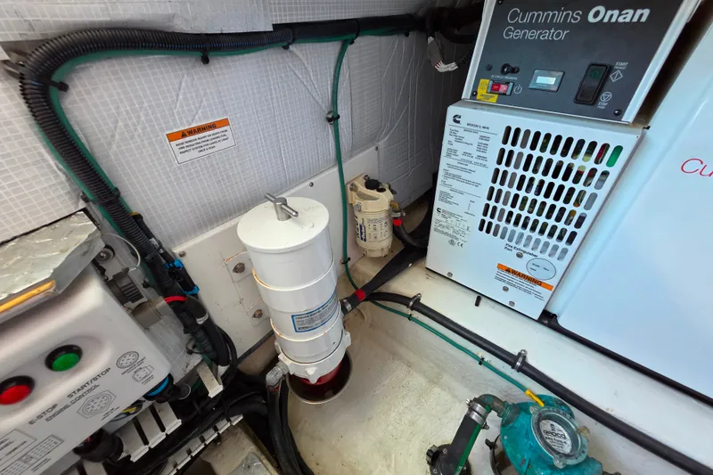 Slide: The Image of Engine room of 2018 Back Cove 37 with Cummins Onan generator and wiring. - 92