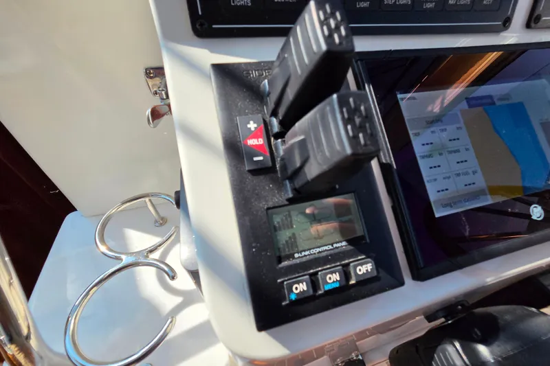 Slide: The Image of Control panel of a 2018 Back Cove 37 boat with navigation display. - 104