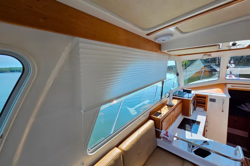 Slide: The Image of Interior of 2018 Back Cove 37 yacht with modern kitchen and scenic window view. - 79