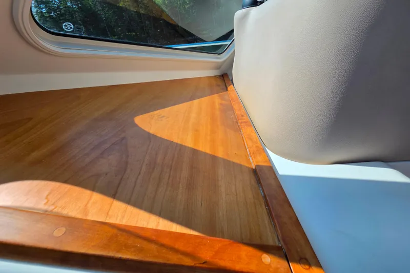Slide: The Image of Interior view of 2018 Back Cove 37 boat, featuring wooden surface and window. - 70