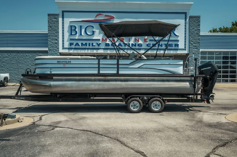 The Image of 2022 Cypress Cay Seabreeze 252 pontoon boat on trailer at marine center. - 1
