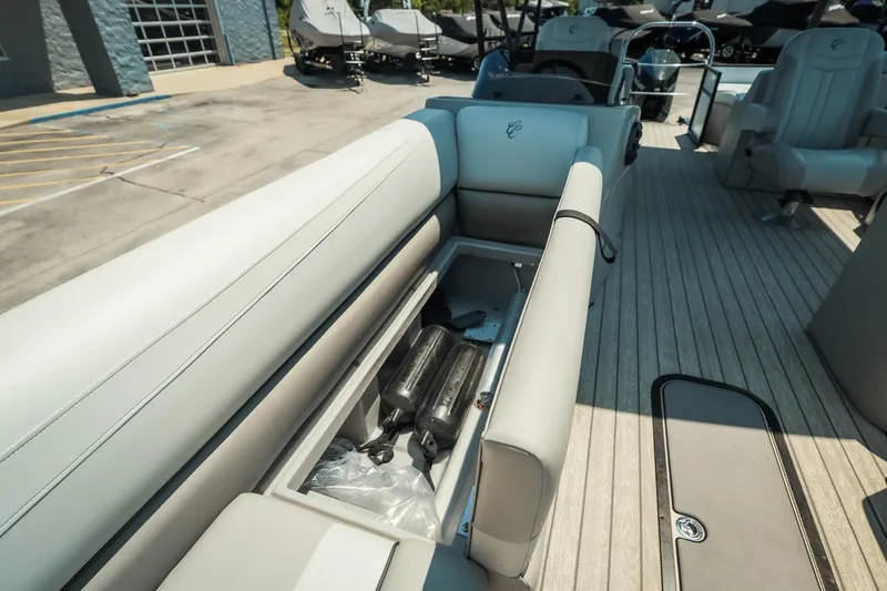 Slide: The Image of 2022 Cypress Cay Seabreeze 252 pontoon boat with open storage compartment on deck. - 26
