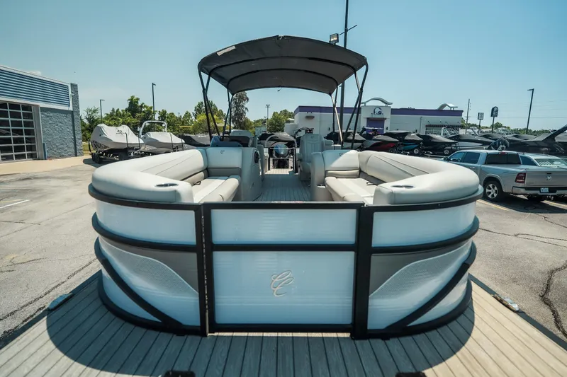 Slide: The Image of 2022 Cypress Cay Seabreeze 252 pontoon boat with spacious seating, parked outdoors. - 10